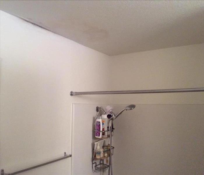Water damage in the ceiling of a bathroom